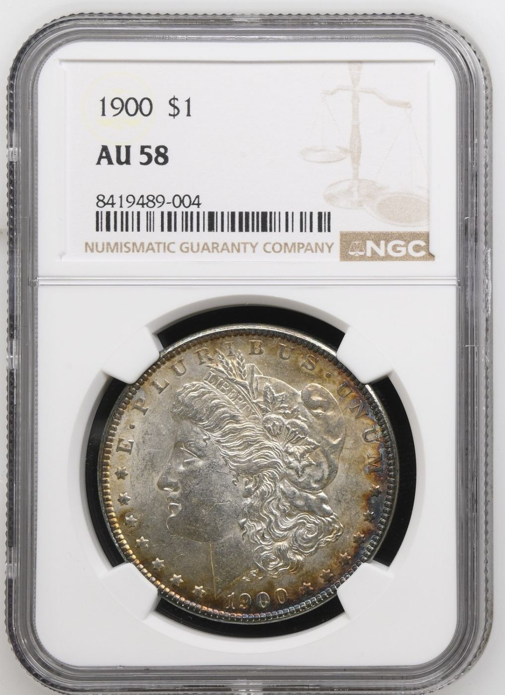 A 1900 Morgan silver dollar graded AU 58 by NGC
