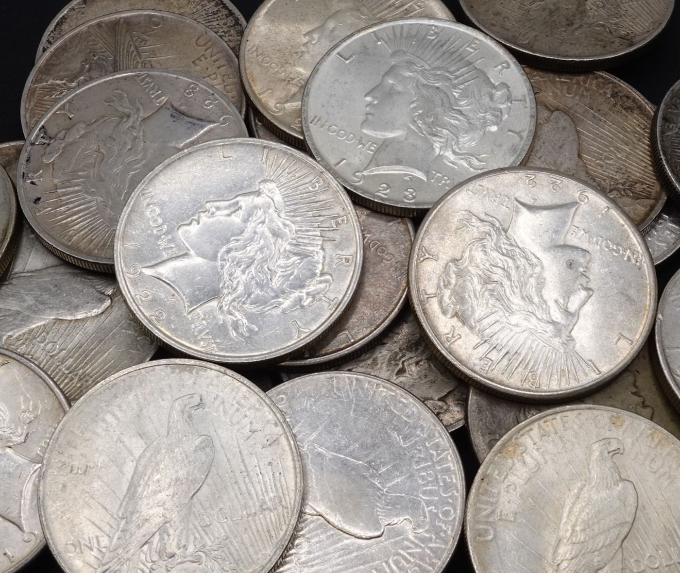 A pile of 90% silver Peace dollars