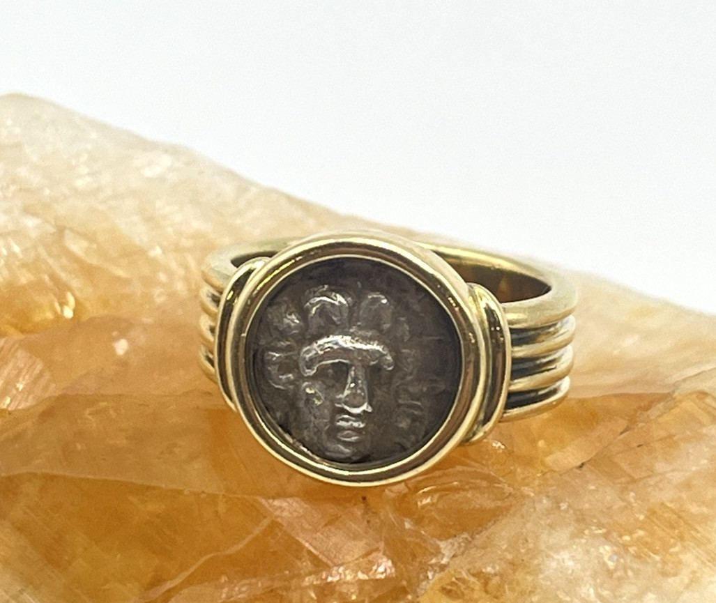 An ancient Rhodes coin set in an 18k gold ring