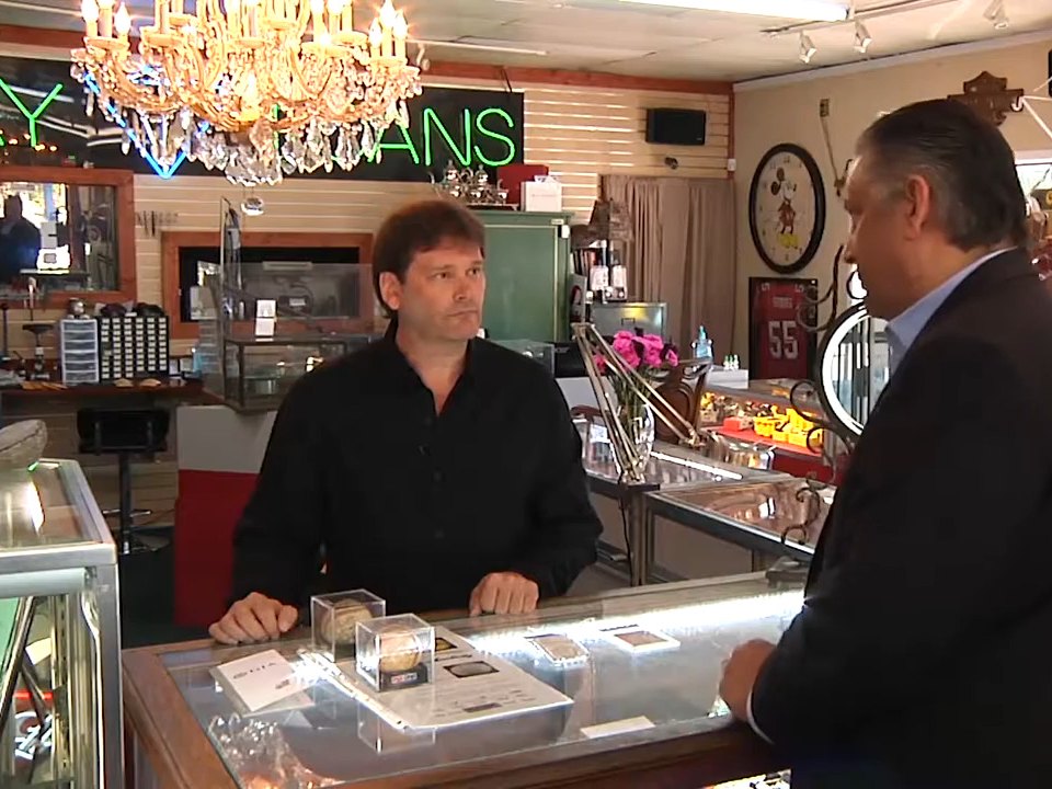 A TV interview at the counter inside Sunset Jewelry & Loan